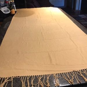 Gold/camel colored pashmina.  31” X 73” fringed